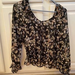 sheer cover shirt with a black background and flowers on top